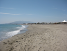 The wide sandy beach just the other side of the pool area.